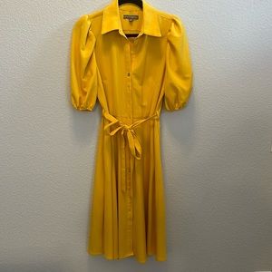 Yellow calf length dress.